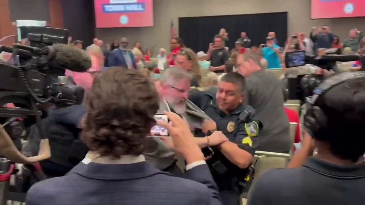Protester forcibly escorted out of Republican town hall hosted by Marjorie Taylor Greene