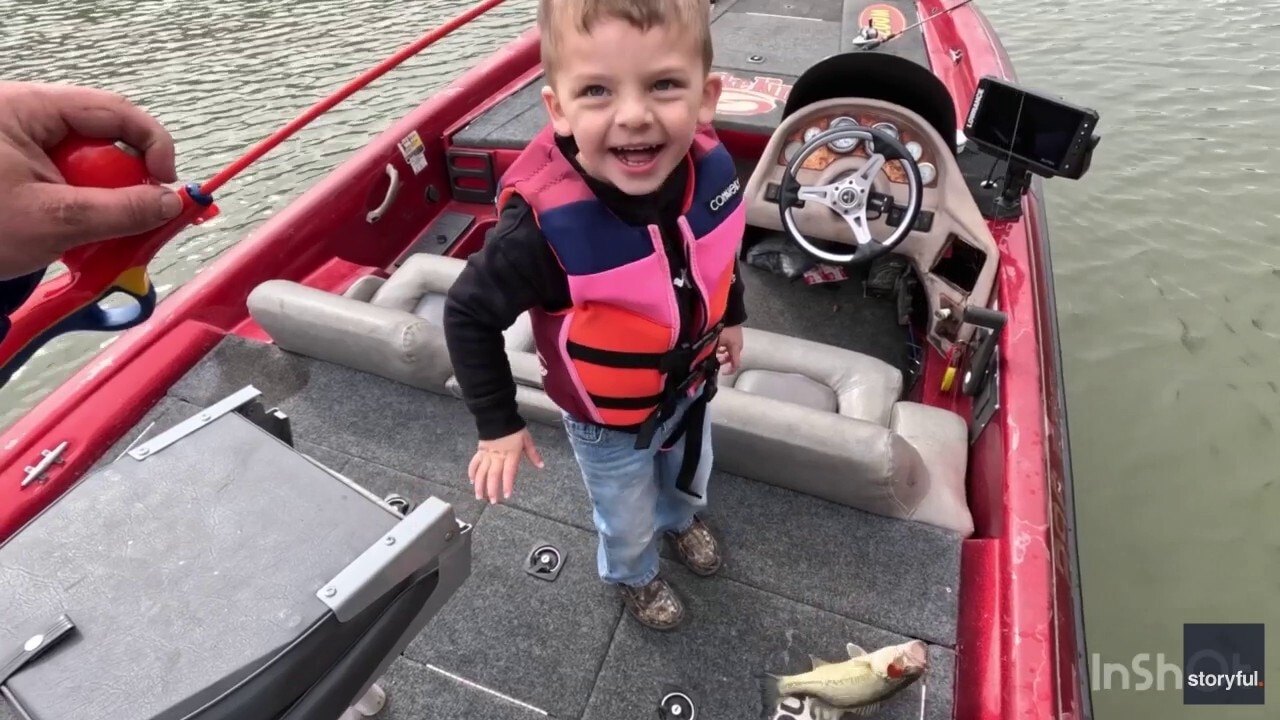 Little boy impresses dad by catching his first fish