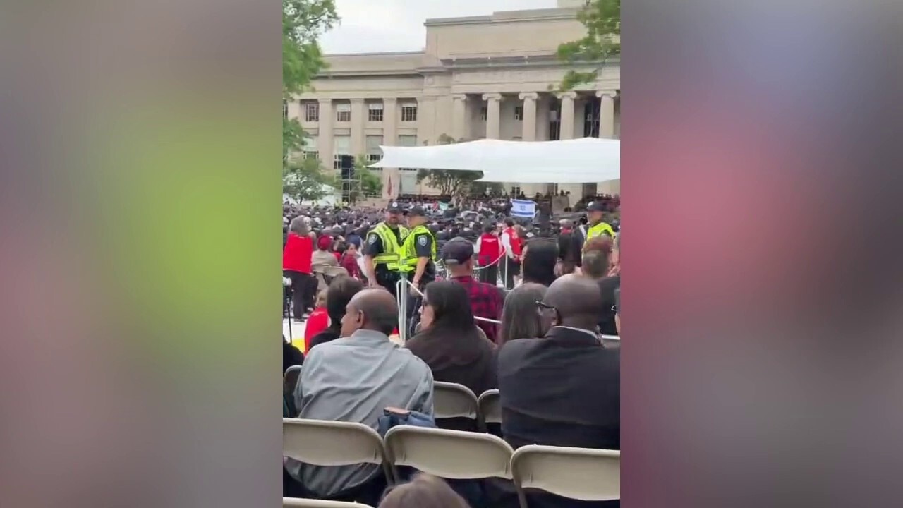 MIT graduates seen walking off while commencement speaker delivers address