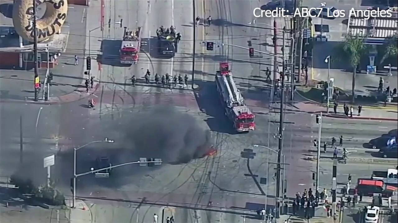 Anti-ICE rioters torch car in tense standoff with authorities