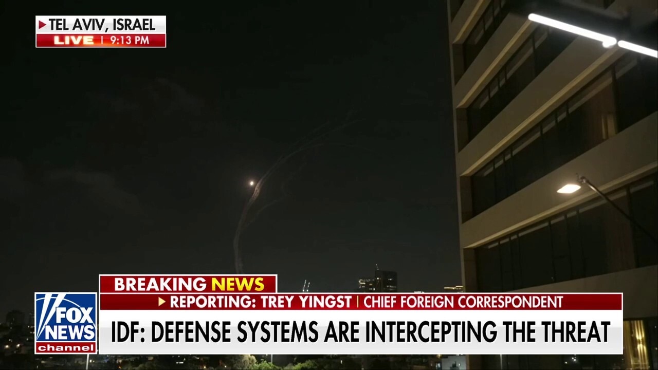 Fox News' Trey Yingst and camera crew run for cover in Israel as Iranian missiles strike