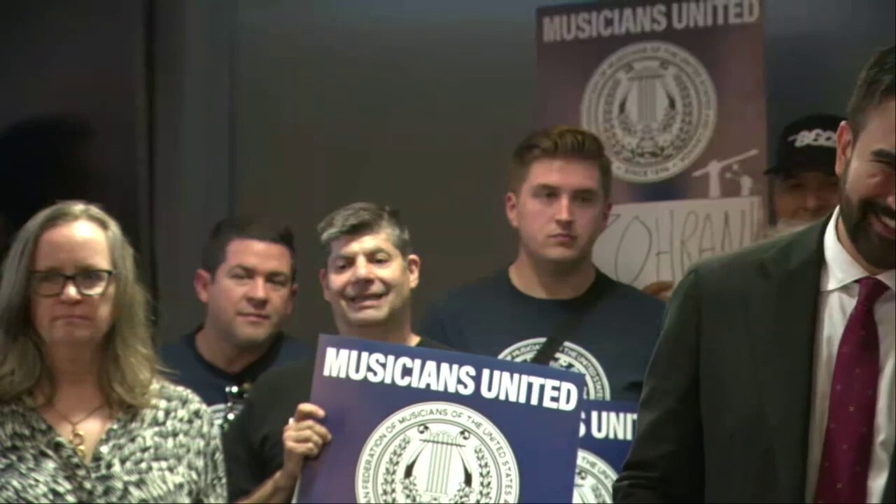 Zohran Mamdani pulled away by a campaign staffer