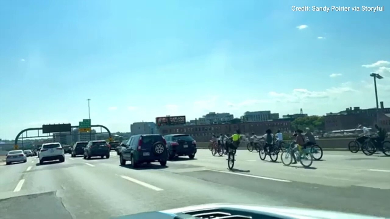 Bikers flood Boston highway, one crashes into police cruiser during wild takeover