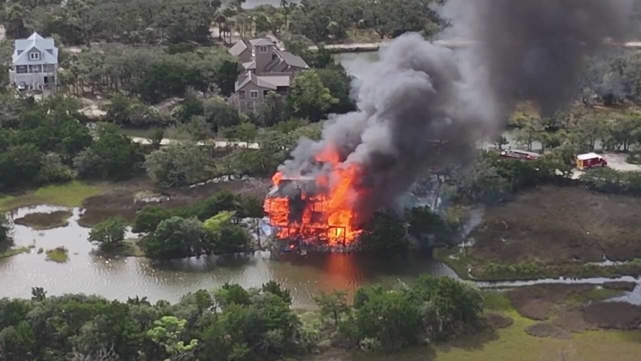 Aerial footage shows judge's waterfront mansion in flames