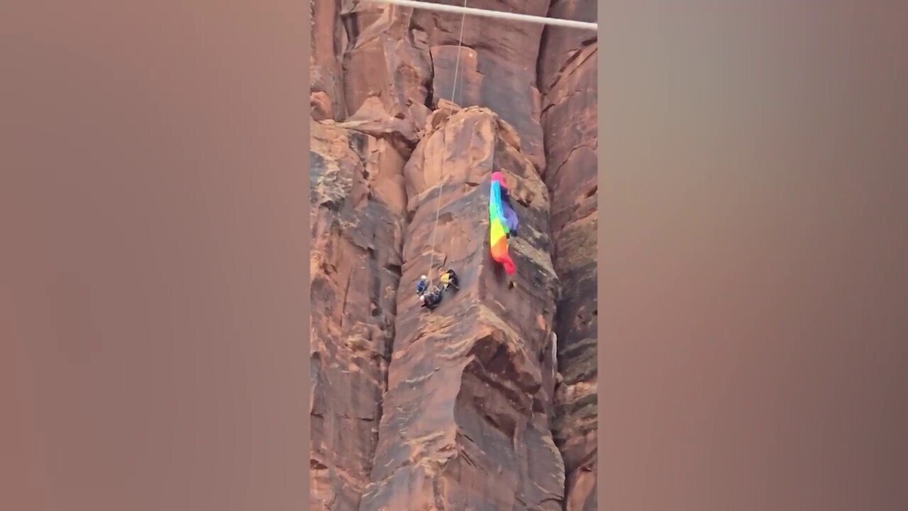 Heart-stopping video shows moment BASE jumper is rescued on Utah canyon face