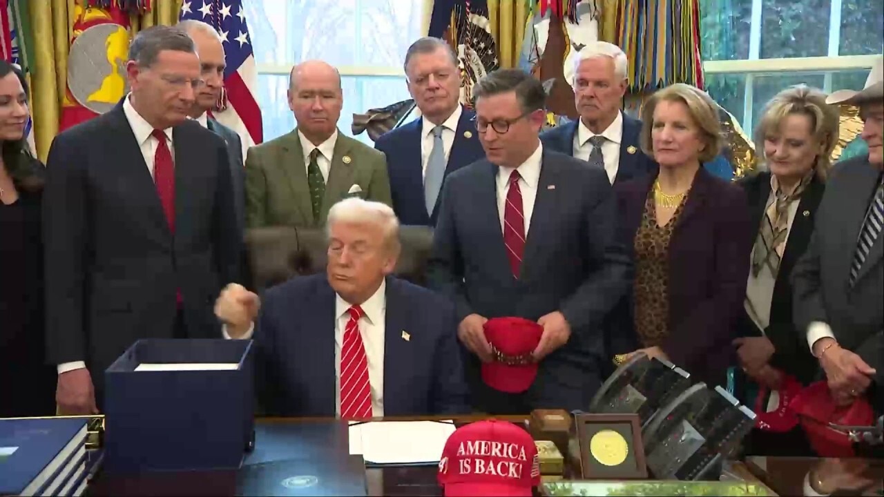 Mike Johnson calls Trump’s ‘America Is Back’ hat ‘the right slogan’ at White House bill signing