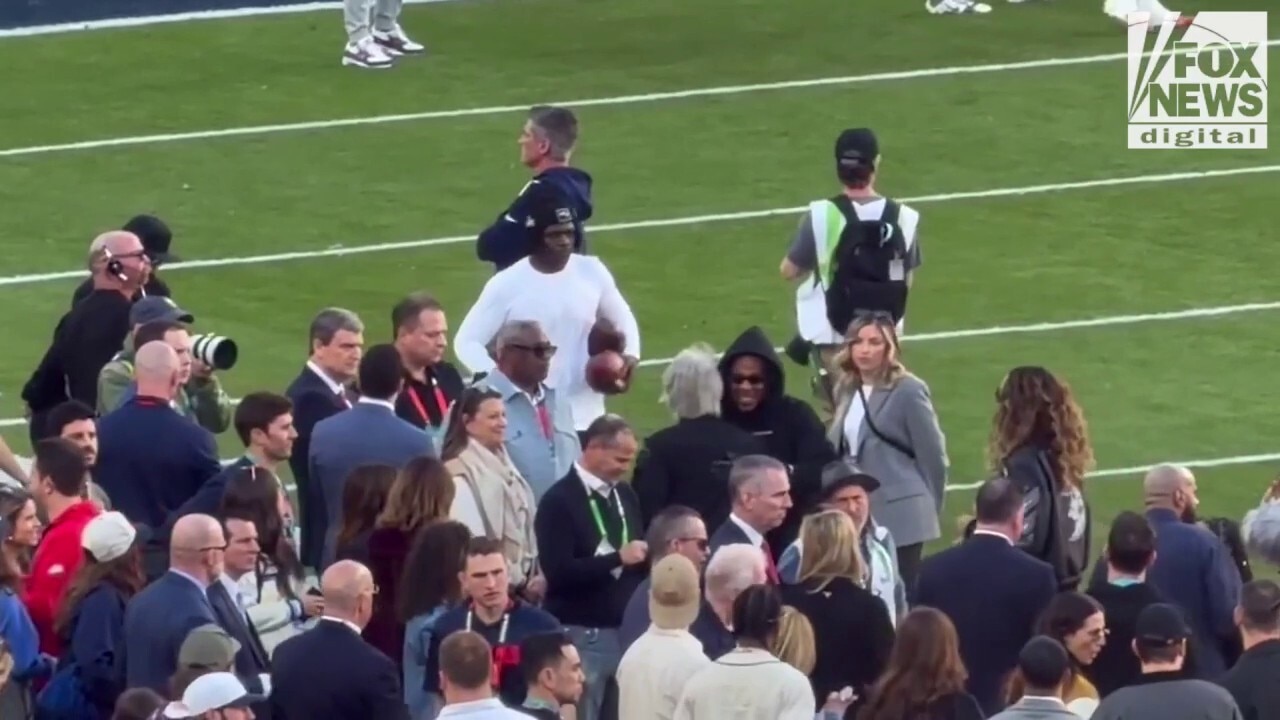 Jon Bon Jovi and Jay-Z greet each other at Super Bowl