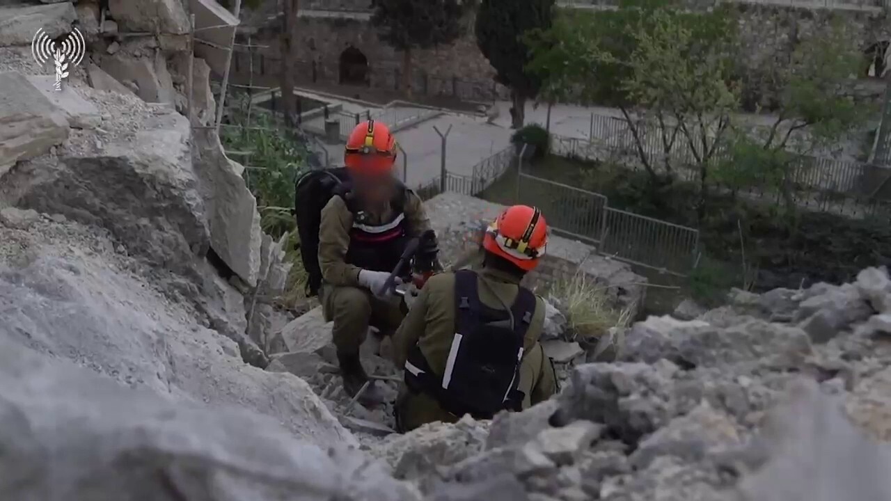 Crews clear debris site after missile fall in Jerusalem
