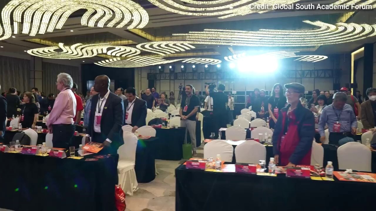 WATCH: Neville Roy Singham and conference attendees in Shanghai stand to 'The Internationale," a communist anthem