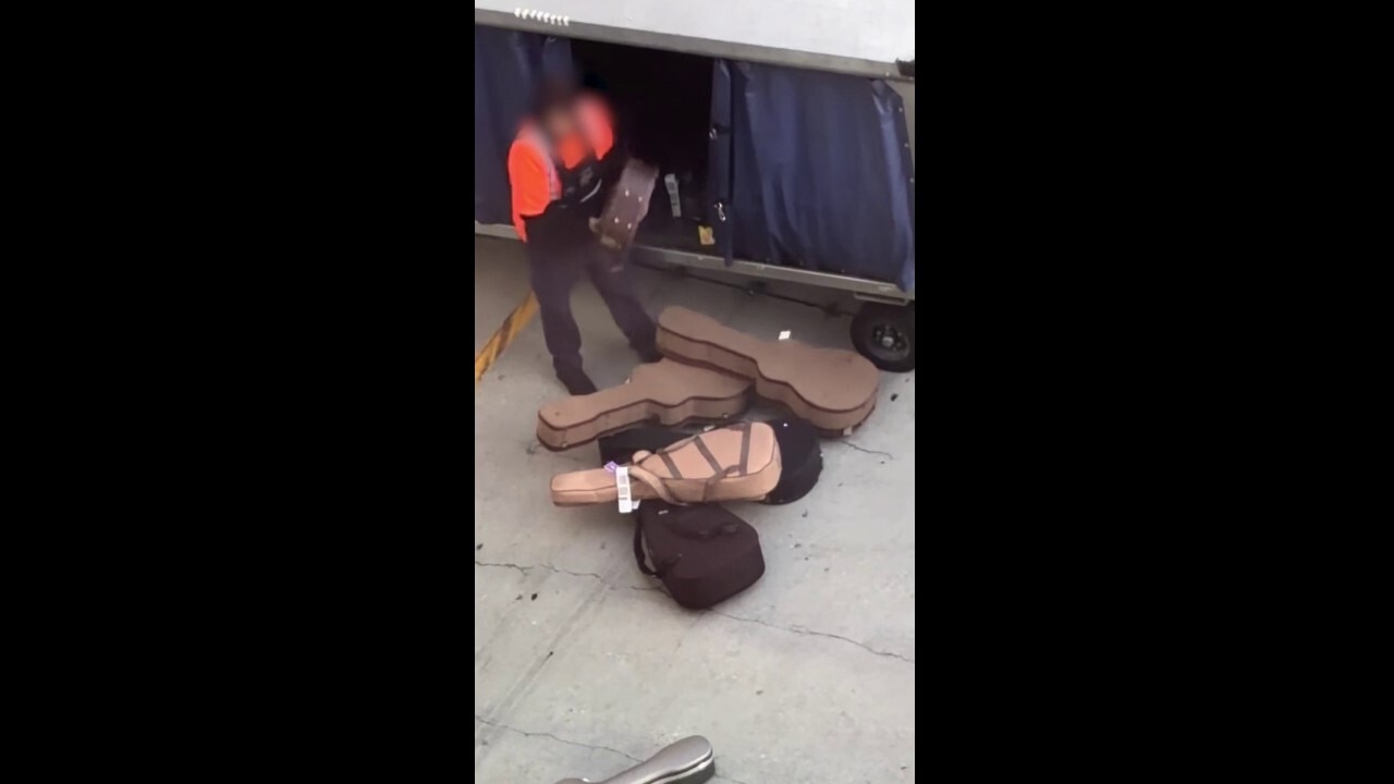 Caught on camera: Airport crew member repeatedly throws guitar cases onto tarmac