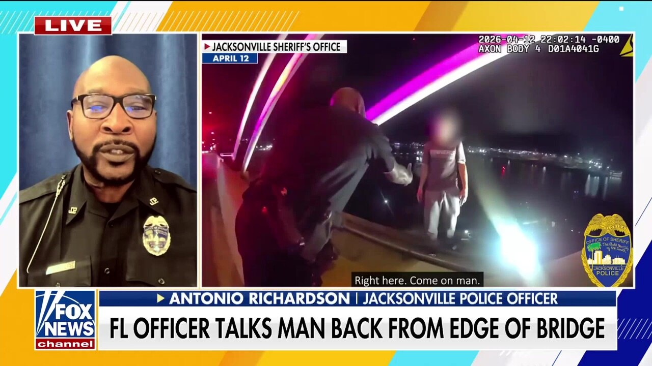Florida officer talks man off bridge in dramatic rescue