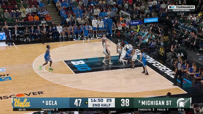 Donovan Dent weaves through traffic for a two-point layup