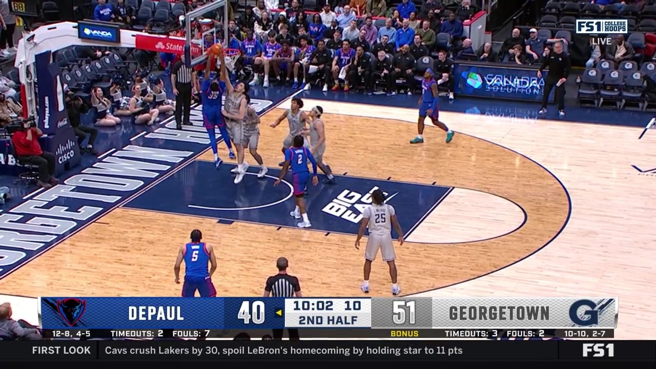 NJ Benson dunks off an assist from Layden Blocker