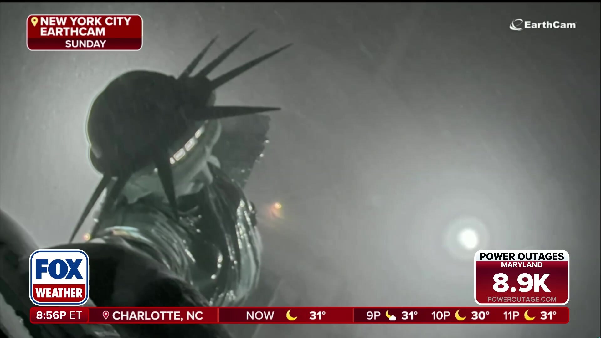 Statue of Liberty shrouded in snow during New York blizzard