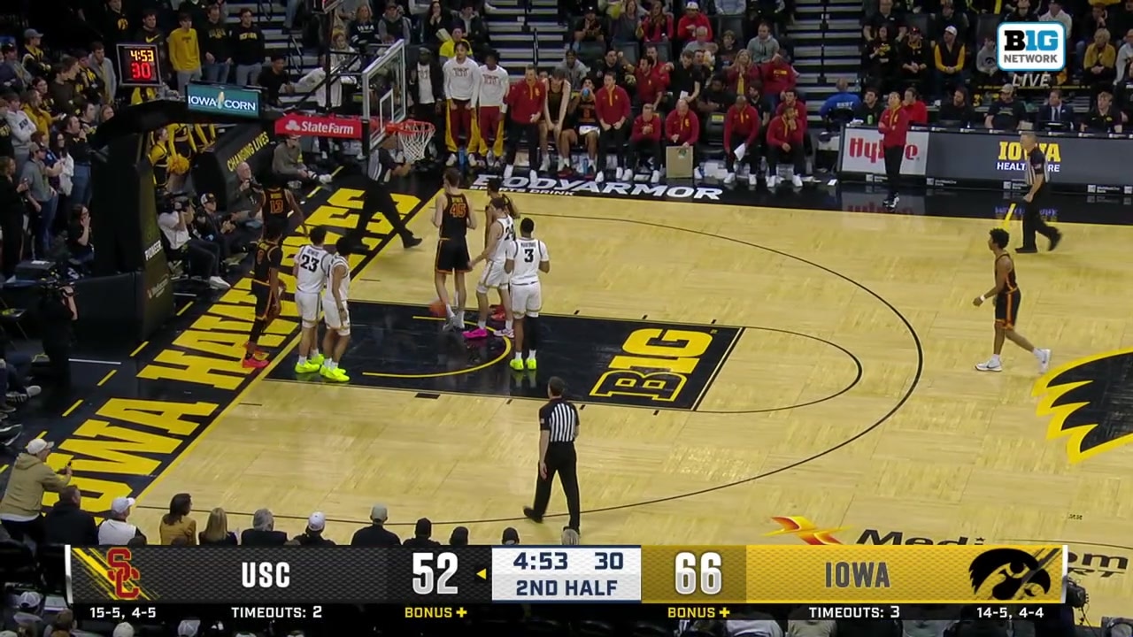 Kam Woods converts a two-point layup plus the foul