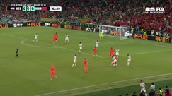 Micky van de Ven's powerful shot is tipped over by Bono