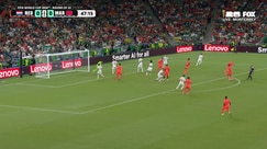 A flicked header on target is saved by Yassine Bounou