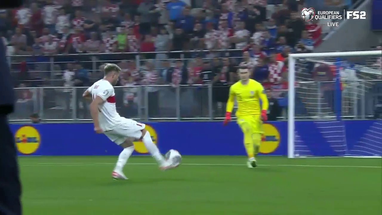 Baris Yilmaz chips the keeper to give Turkey a 1-0 lead over Croatia