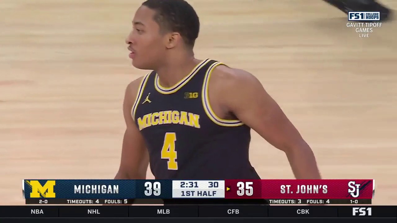 Michigan’s Nimari Burnett hits a jumper and scores a career-high 21 points in the first half vs. St. John’s