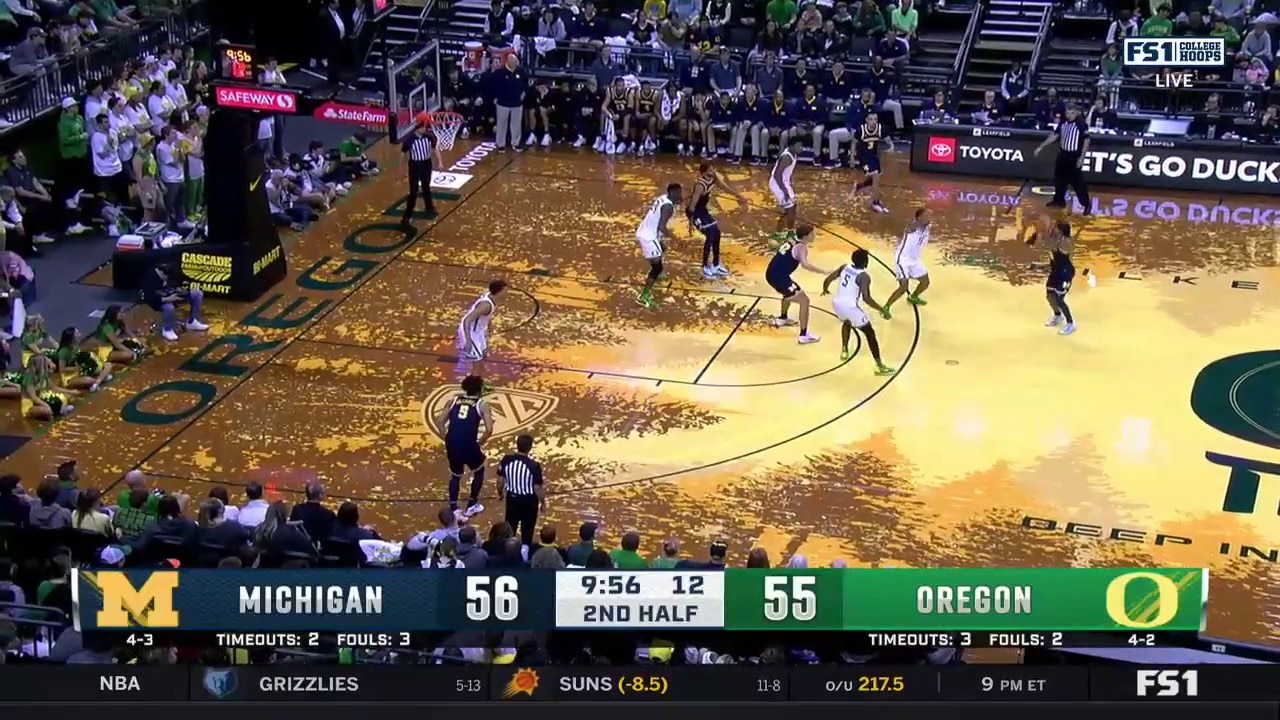 Michigan's Dug McDaniel drills a 3-pointer from way downtown vs. Oregon