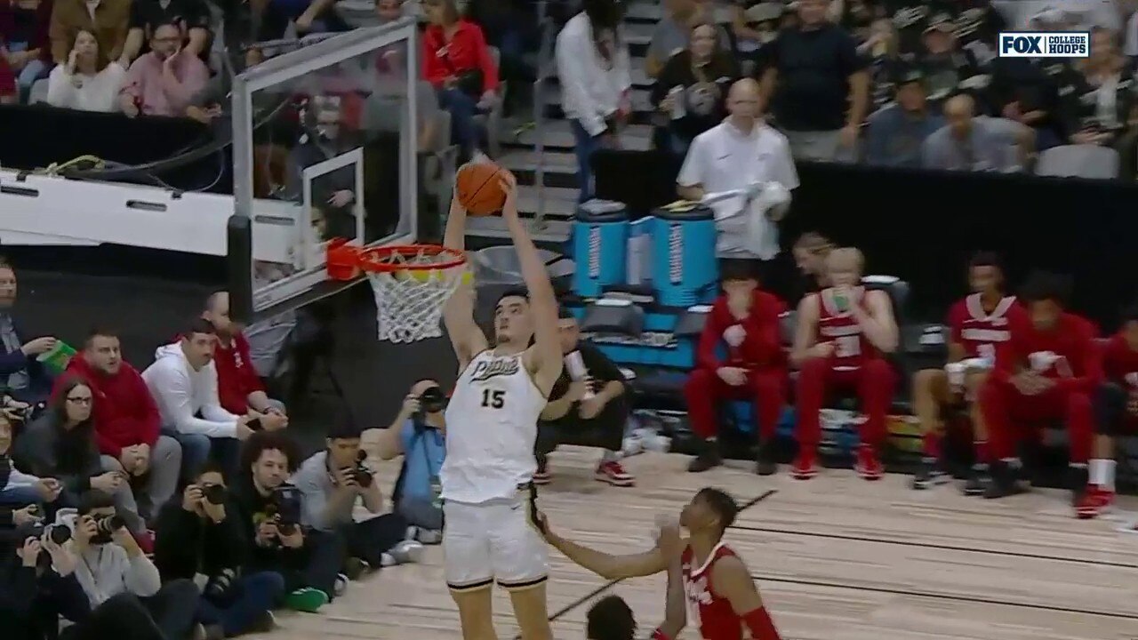 Purdue’s Zach Edey throws down a two-handed slam on the alley-oop from Fletcher Loyer