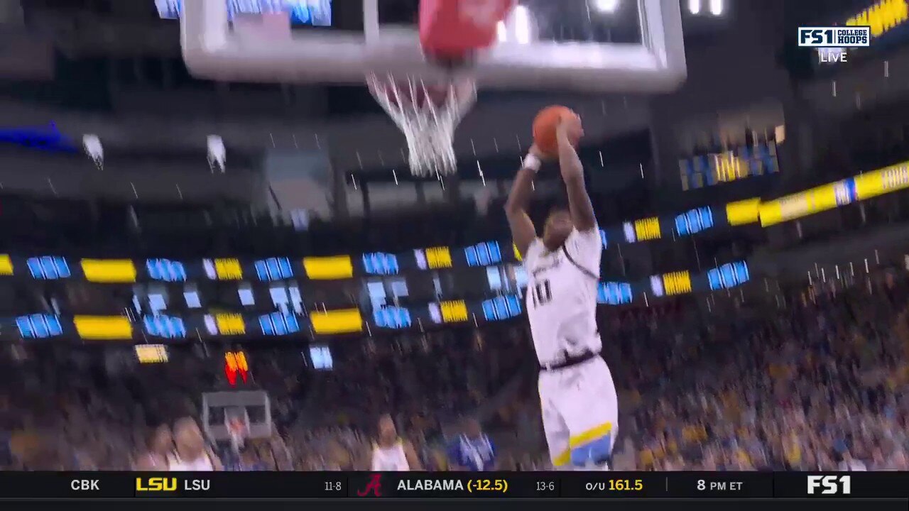 Marquette's Zaide Lowery throws down the two-handed jam to close gap against Seton Hall