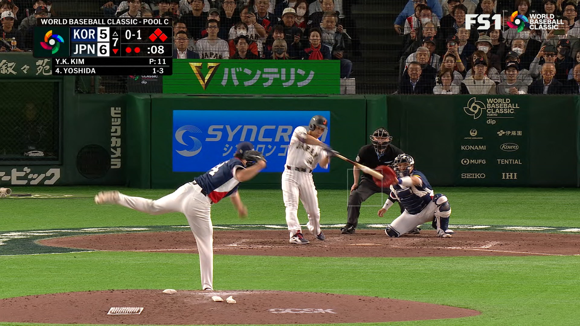 Japan's Masataka Yoshida hits single, driving in two runs