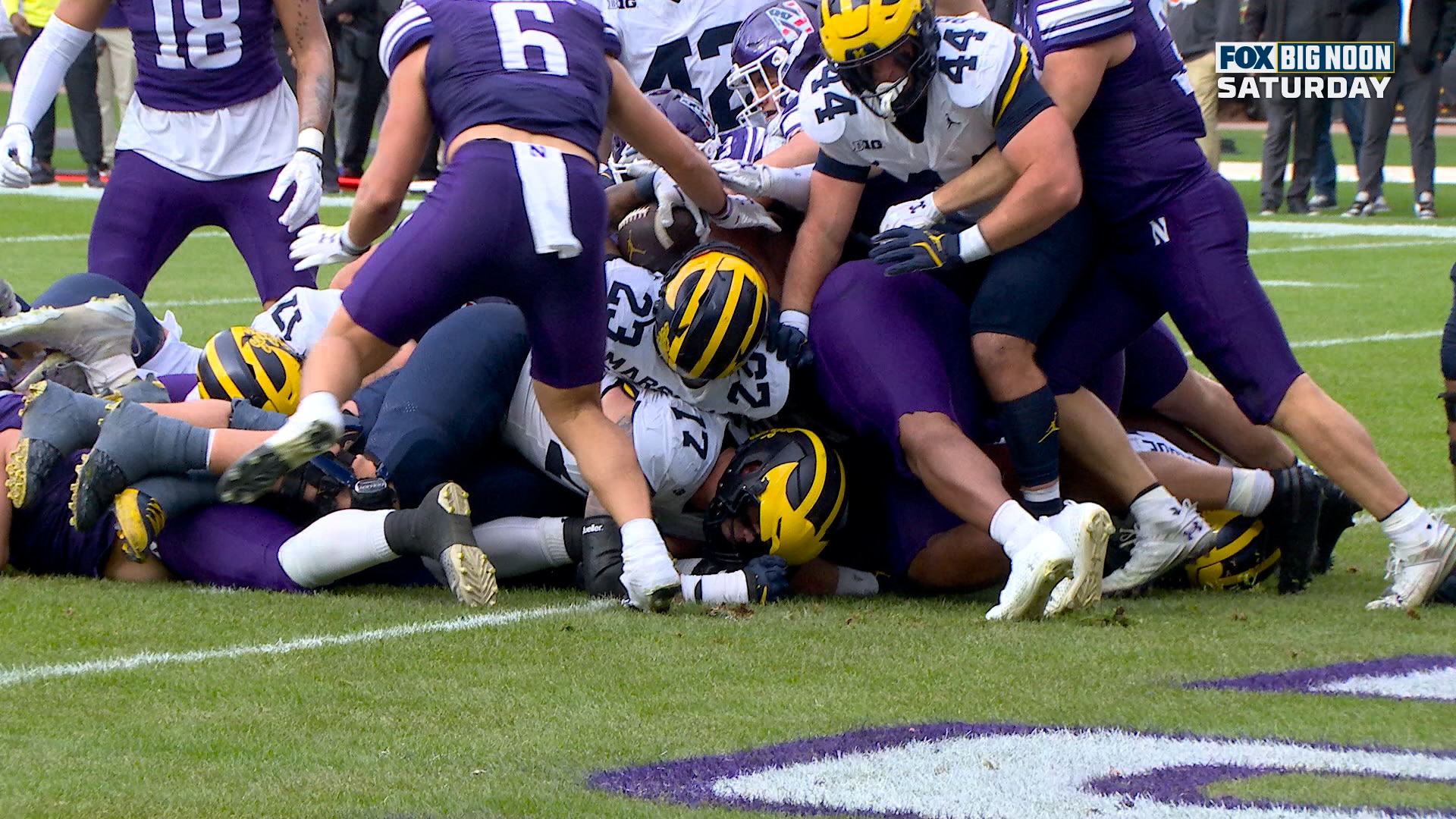 Jordan Marshall punches in one-yard TD to give Michigan a 7-0 lead over Northwestern