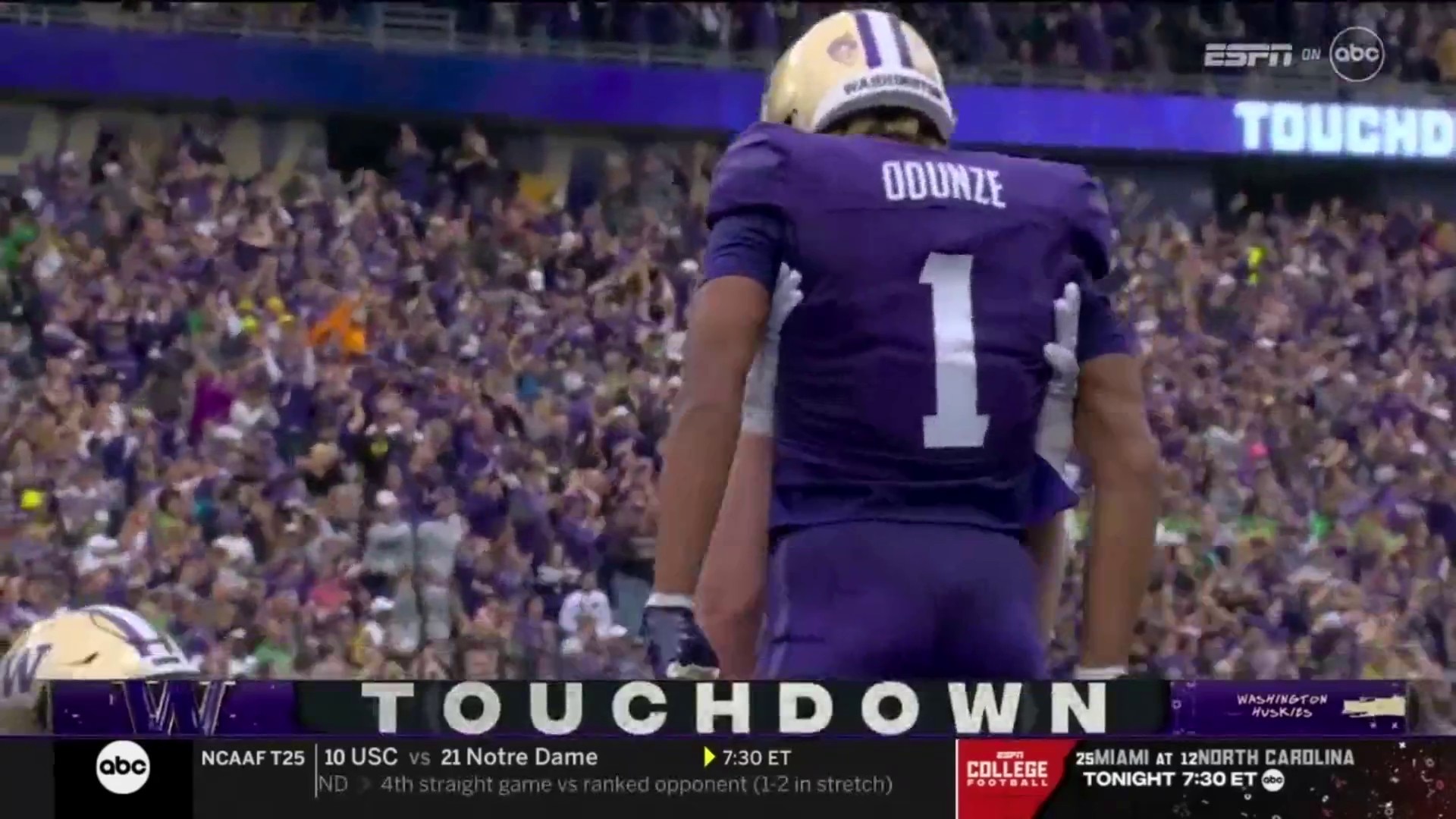 Washington's Michael Penix Jr. links with Rome Odunze on a 17-yard touchdown to extend the lead