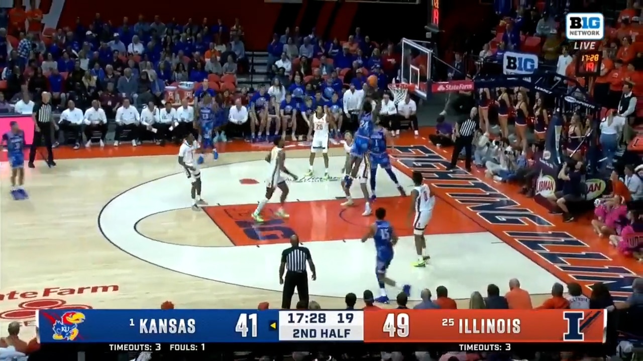 KJ Adams Jr. rises for the two-hand slam in traffic, cutting Kansas’ deficit vs Illinois