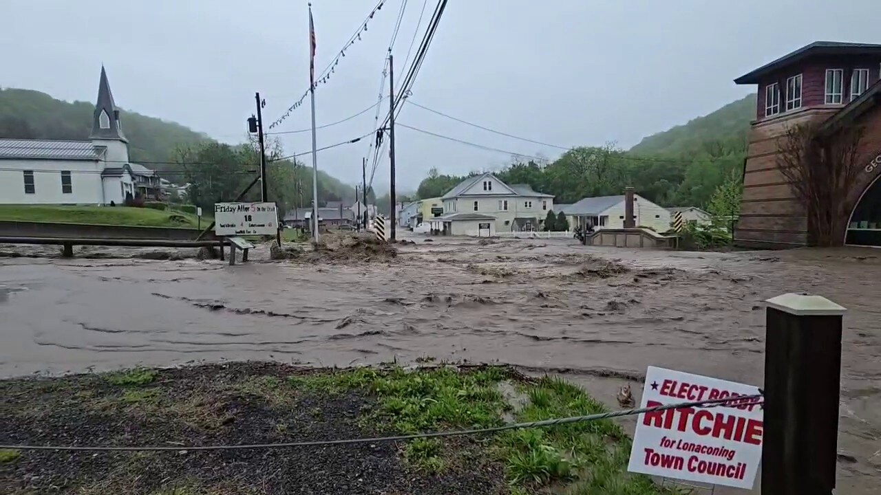 Roads in Lonaconing, Maryland, are overwhelmed with heavy flood waters