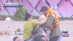 Police rescue baby from deadly flooding in Central Vietnam