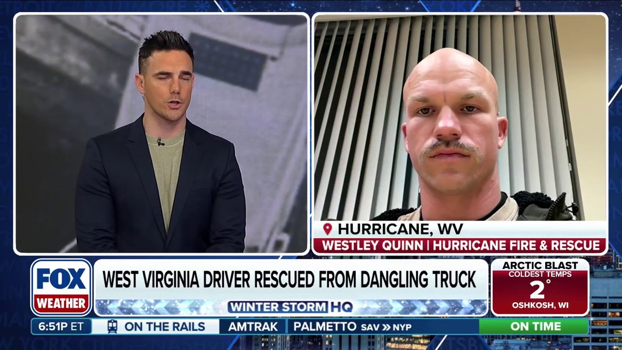 Volunteer firefighter rescues West Virginia driver from dangling truck 