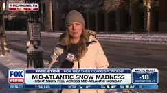 Mid-Atlantic snow causing travel concerns in Richmond, Virginia amid overnight freeze
