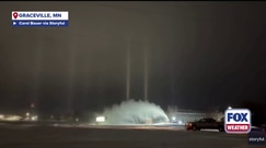 Wintry weather triggers light pillar phenomenon as light beams illuminate the sky in Graceville, Minnesota