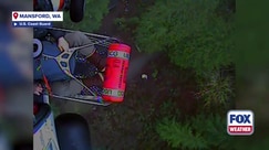 Watch: 2 hunters rescued after flooding leaves them stranded in Washington