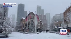 People in Jersey City, New Jersey, experience snowfall