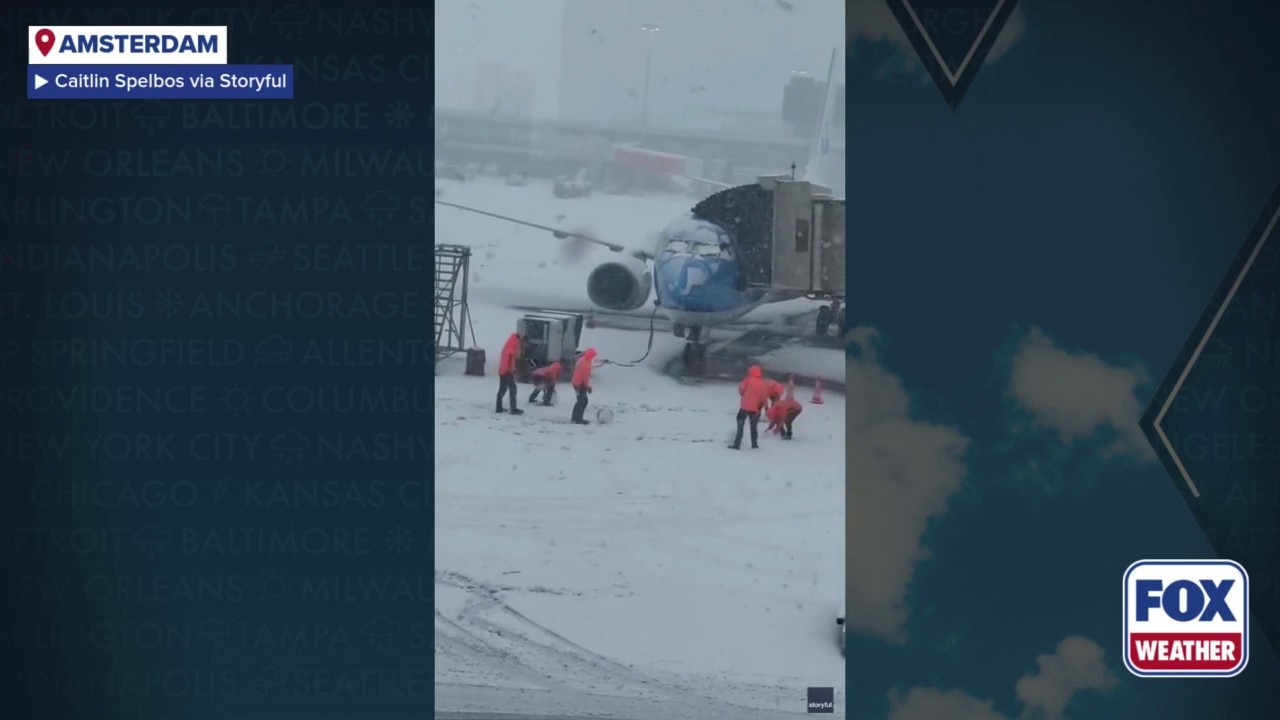 Watch: Airport workers play in snow in Amsterdam amid winter weather