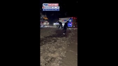 Firefighters in Spokane County, Washington shovel driveway for elderly couple after responding to emergency