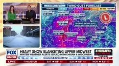 Heavy snow moving east toward the Midwest