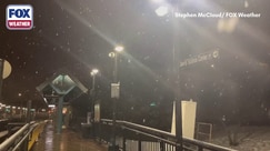 Light snow falls across Jersey City 