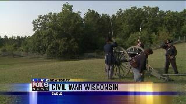 Laura learns how to fire a canon at Old World Wisconsin
