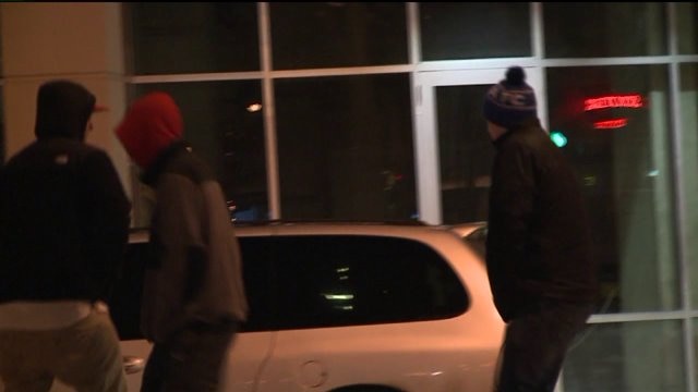 "Ice cold! Very cold!" Folks out on Water Street brave below zero wind chills on New Year`s Eve!