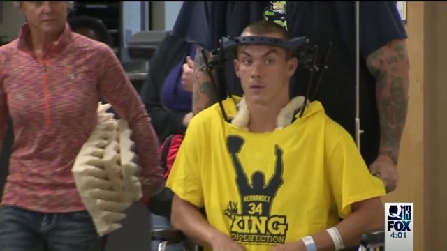 Injured high school football player going home