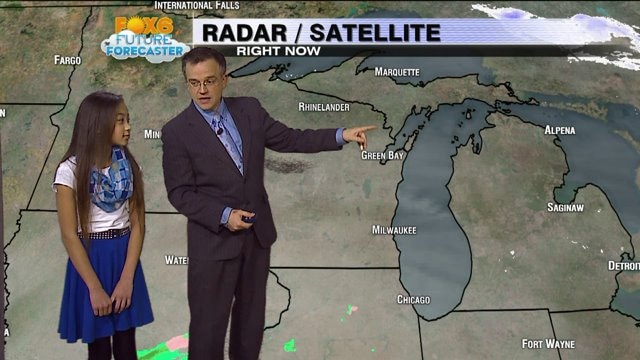 Tholia helps Rob Haswell with the weather