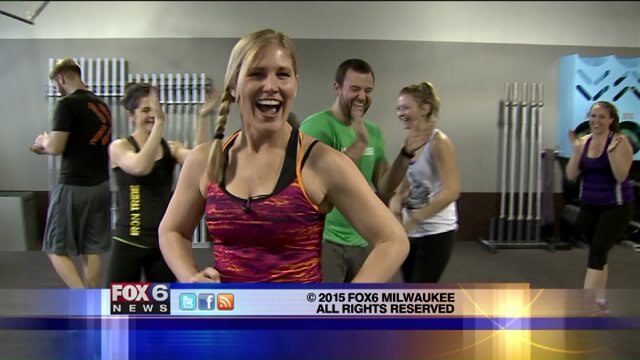 Laura participates in a cool down at Iron Tribe Fitness
