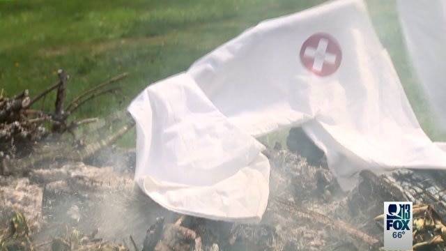 Redmond business owner burns KKK robe