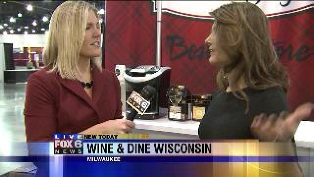 Laura checks out great deals at Wine & Dine Wisconsin