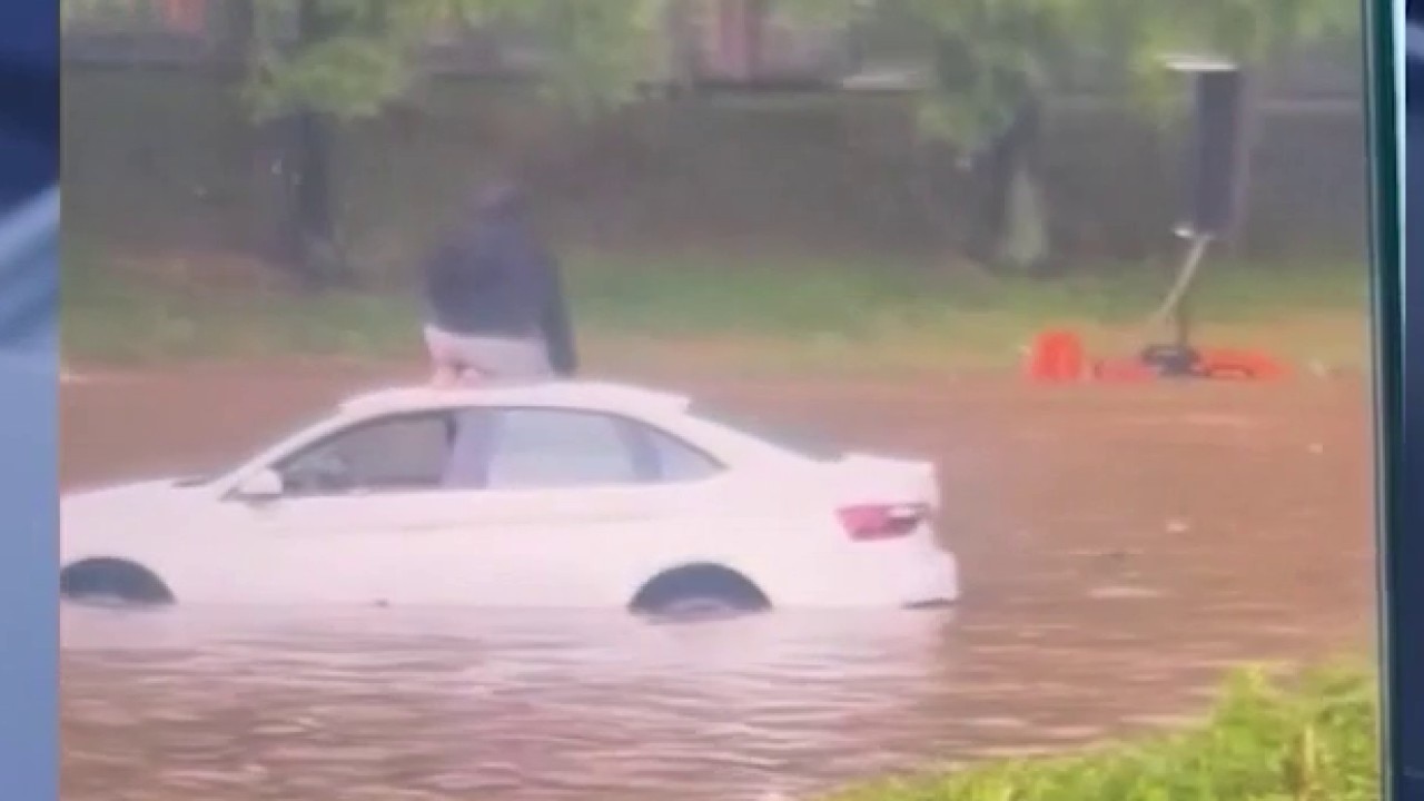 Flood survivor recounts being rescued from stuck car