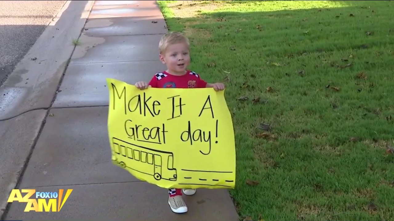 School bus full of kids serenades Phoenix toddler